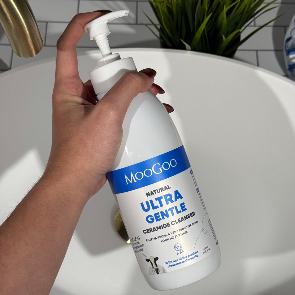MooGoo Ultra Gentle Ceramide Cleanser shown in hand, natural sodium cocoyl glutamate wash for very sensitive and reactive skin