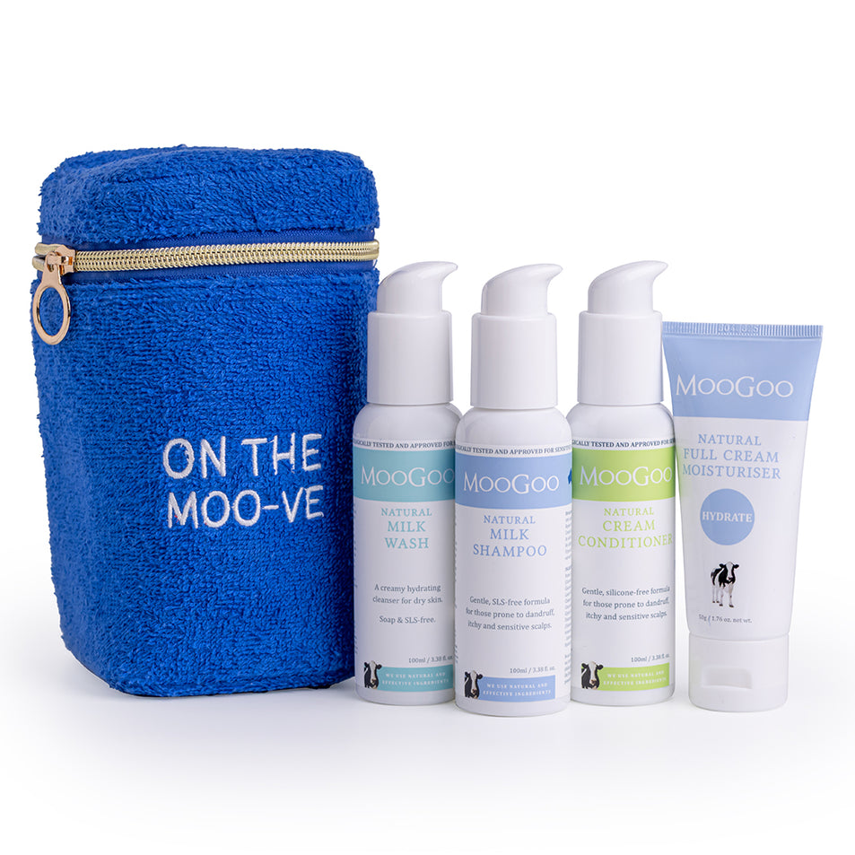 MooGoo Travel Pack on white background, including blue terry towelling bag, travel-sized Milk Shampoo, Cream Conditioner, Milk Wash and Full Cream Moisturiser - ideal for sensitive skin, hydration and scalp health